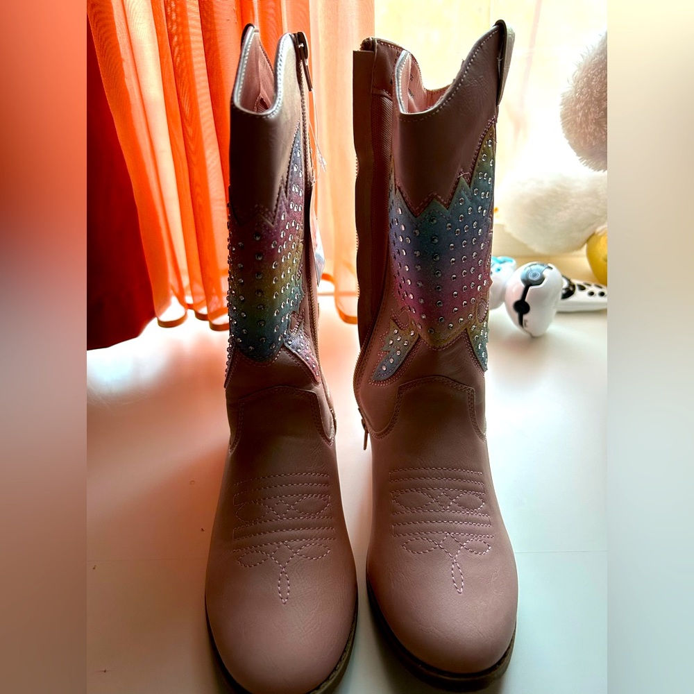 Pink cowboy boots with rainbow pattern and rhinestones